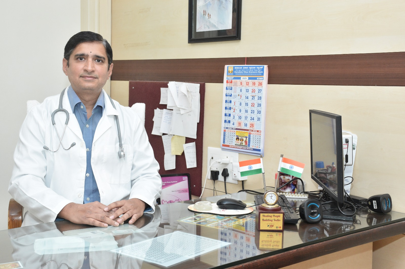 Dr. Santosh Kulkarni at his consultation desk in Tavargeri Nursing Home Pvt Ltd